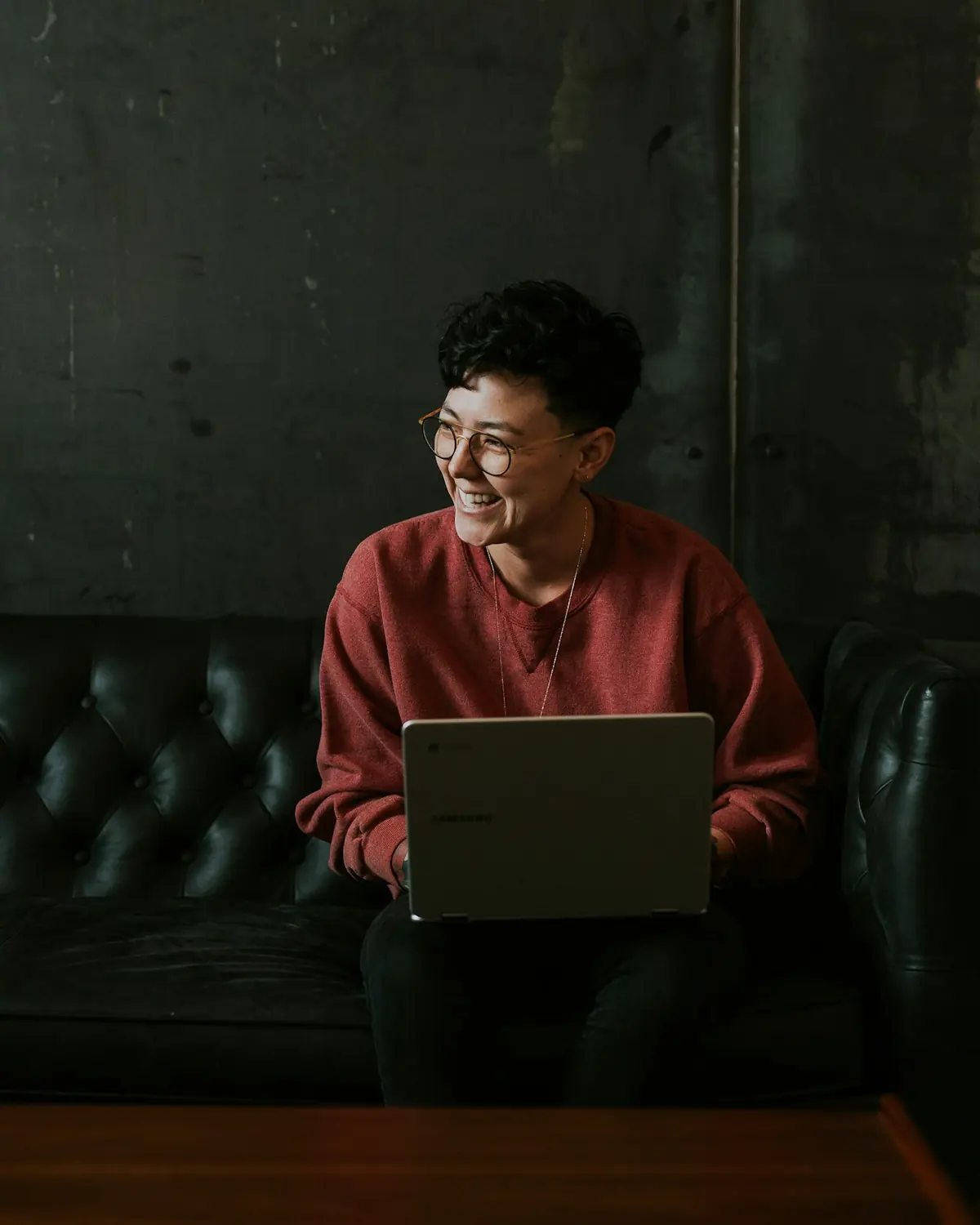 A candidate sitting with a laptop, working through the assessment in their own time.